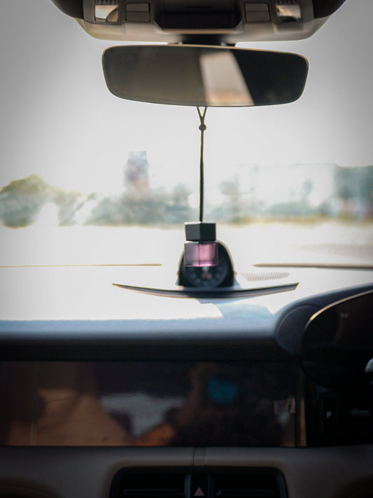 SCNTD Noir transparent black car fragrance diffuser inspired by Dior Sauvage, hanging inside car door