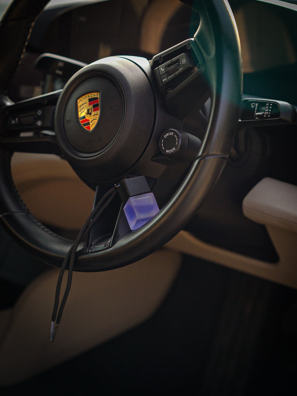 SCNTD Signature blue and purple car diffuser bottles resting on car dashboard with colorful fragrance lineup